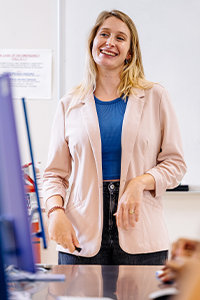 Professor standing in front of a class in a classroom