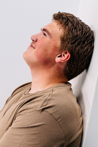 Student leaning back and looking into the sky