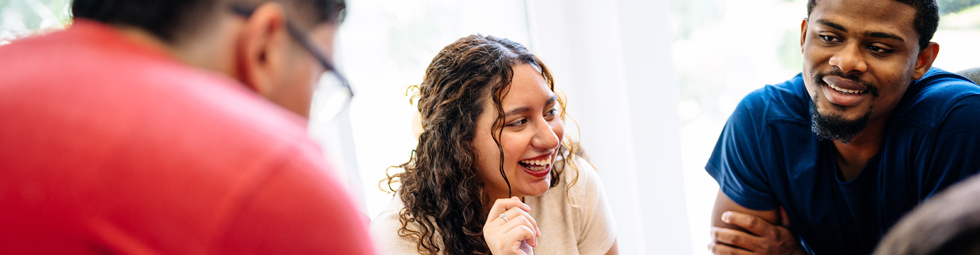 Three students smiling.