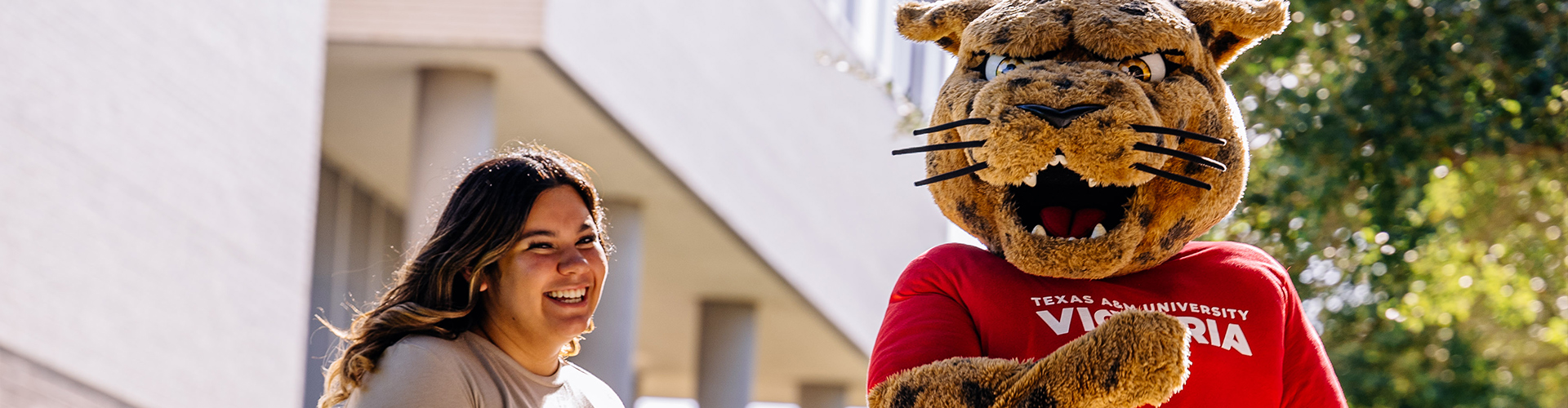 Student and Jax smiling at each other.