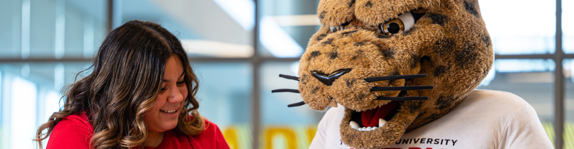 Student with Jax the mascot.