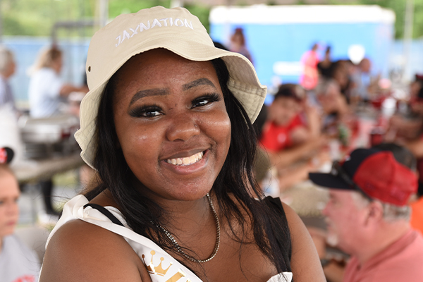 Female student wearing  JAX NATION hat