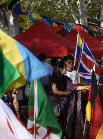 Group of students at the UHV International Festival holding their nation's flags.